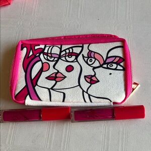 Mac lipglosses free Estée Lauder makeup bag